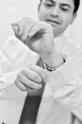 Groom buttoning cuff