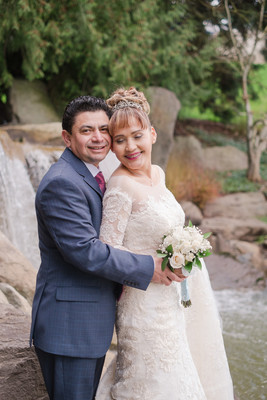 Bride and groom in front of waterfall