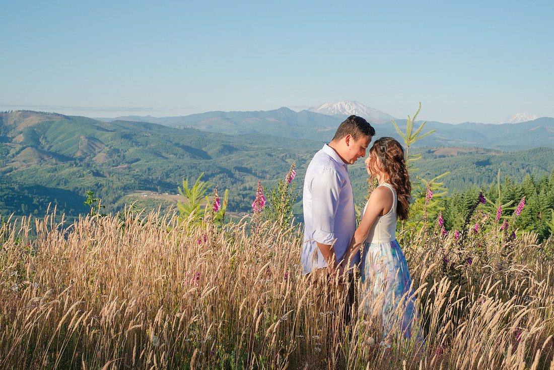"Washington state photographer", "hilltop engagement session", "photo session with a view", "mountain view photo session", "latino couple", "couple photography", "engagement pictures", "wild flowers", "summer engagement pictures"