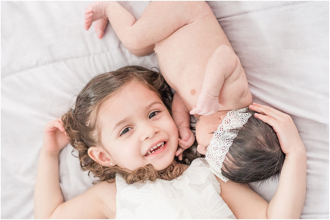 "newborn girl", "newborn with sister", "newborn lifestyle session"